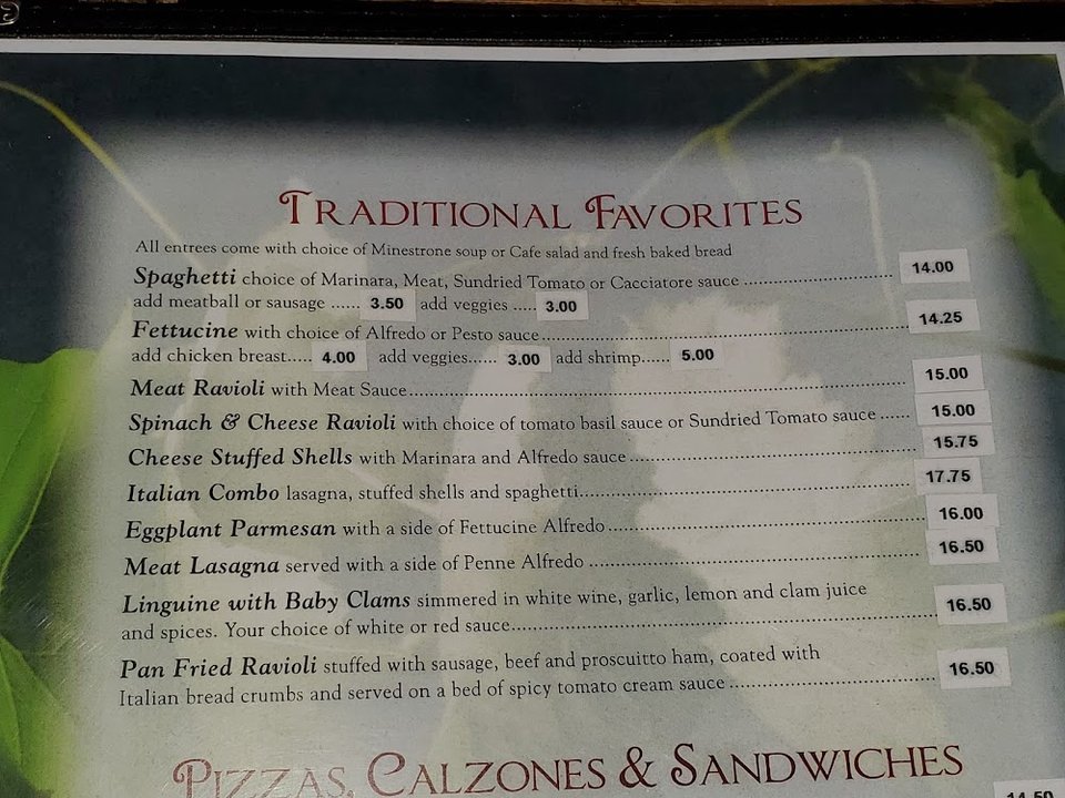 Printed menu with pizzas, pastas, and calzones.